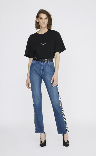 A woman wearing a Stella McCartney black boxy t-shirt