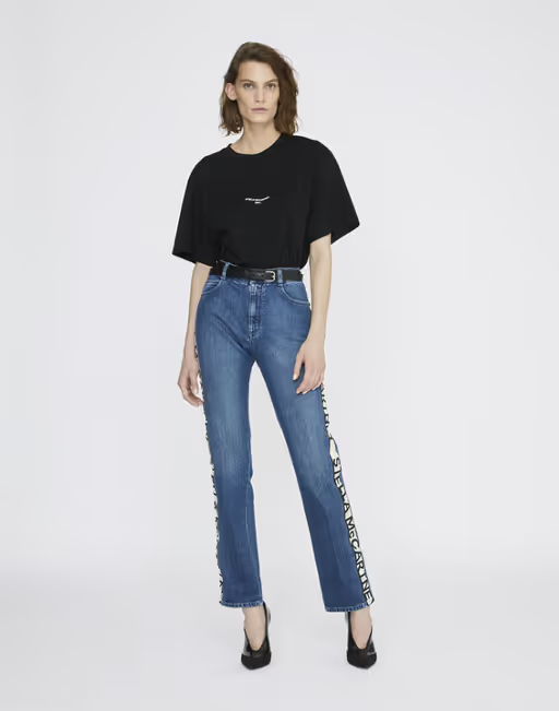 A woman wearing a Stella McCartney black boxy t-shirt