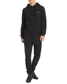 A man wearing a Giuseppe Zanotti black hoodie