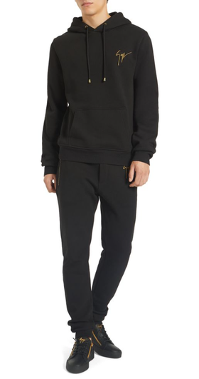 A man wearing a Giuseppe Zanotti black hoodie