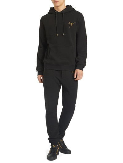 A man wearing a Giuseppe Zanotti black hoodie
