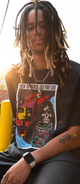 A man wearing a CXXII Apparel black t-shirt
