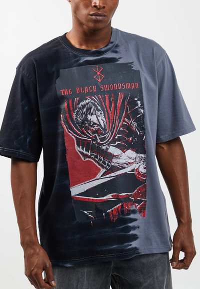 A man wearing a Atsuko the black swordsman split tie dye t-shirt