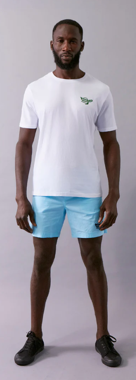 A man wearing a Wata optimism white t-shirt
