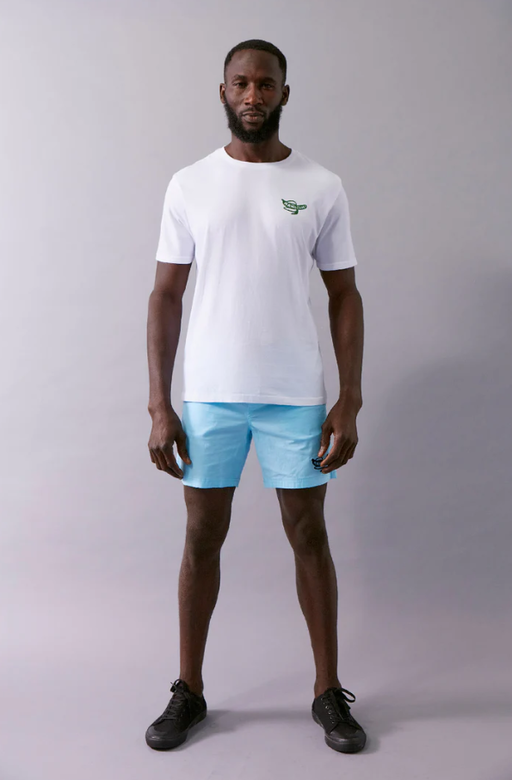 A man wearing a Wata optimism white t-shirt