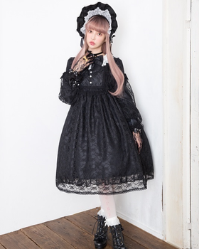 A woman wearing a Angelic Pretty classic bisque doll black one piece