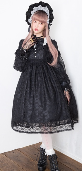 A woman wearing a Angelic Pretty classic bisque doll black one piece