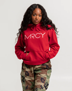 A woman wearing a Art of Homage red hoodie