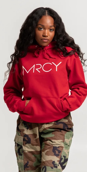 A woman wearing a Art of Homage red hoodie