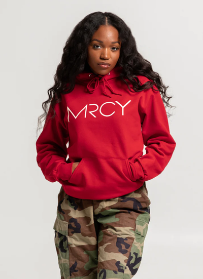 A woman wearing a Art of Homage red hoodie