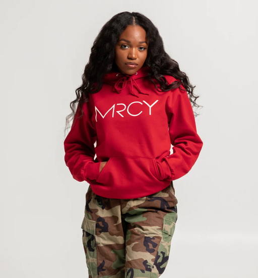 A woman wearing a Art of Homage red hoodie