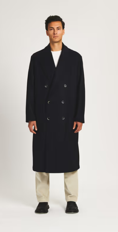 A man wearing a Barena coat murata caramal navy
