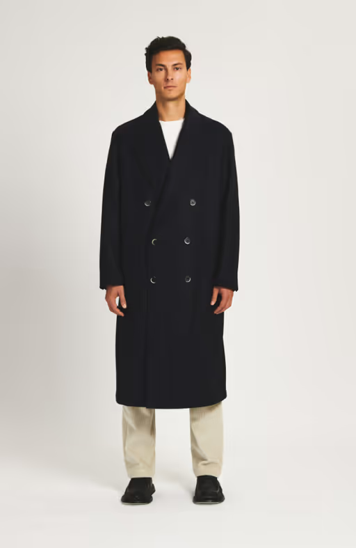 A man wearing a Barena coat murata caramal navy