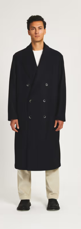 A man wearing a Barena coat murata caramal navy
