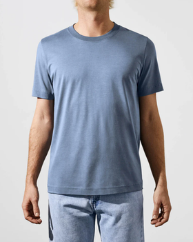 A man wearing a CDLP steel blue t-shirt