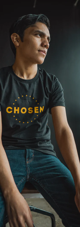A man wearing a Beacon Threads black t-shirt