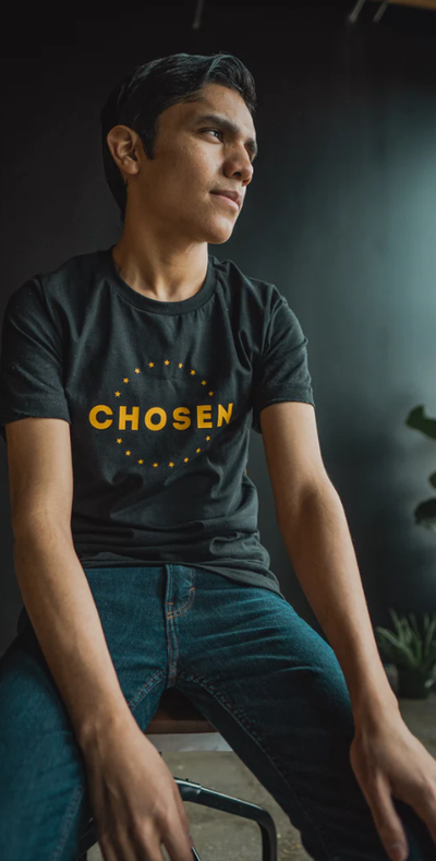 A man wearing a Beacon Threads black t-shirt