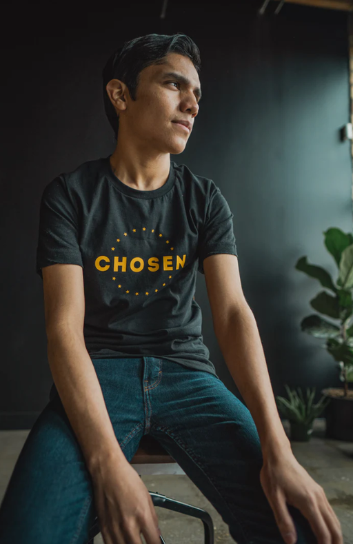 A man wearing a Beacon Threads black t-shirt