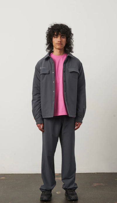 A man wearing a 7 DAYS Active  ebony grey tech padded overshirt