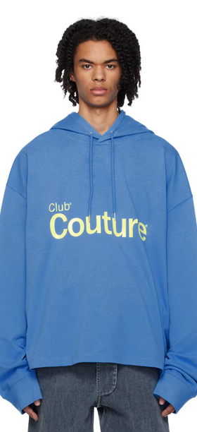 A man wearing a ANONYMOUS CLUB blue bonded hoodie