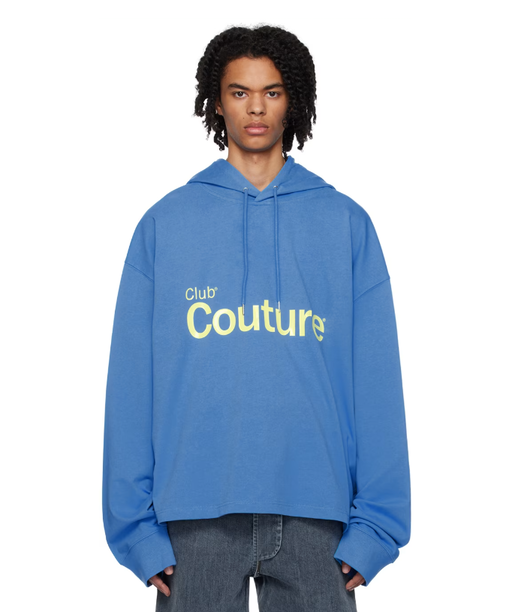 A man wearing a ANONYMOUS CLUB blue bonded hoodie
