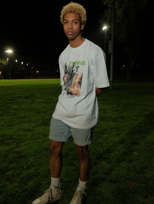 A man wearing a Paradise Youth Club white t-shirt