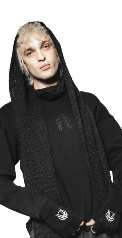A man wearing a YRU black long sleeve t-shirt with cowl neck
