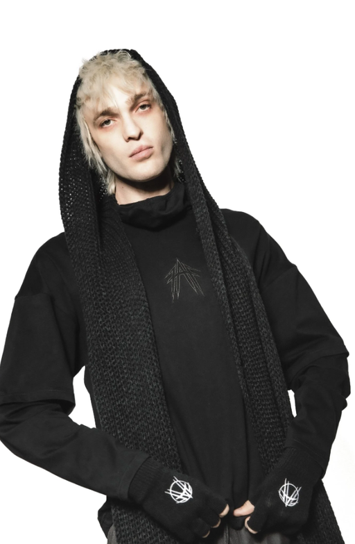 A man wearing a YRU black long sleeve t-shirt with cowl neck