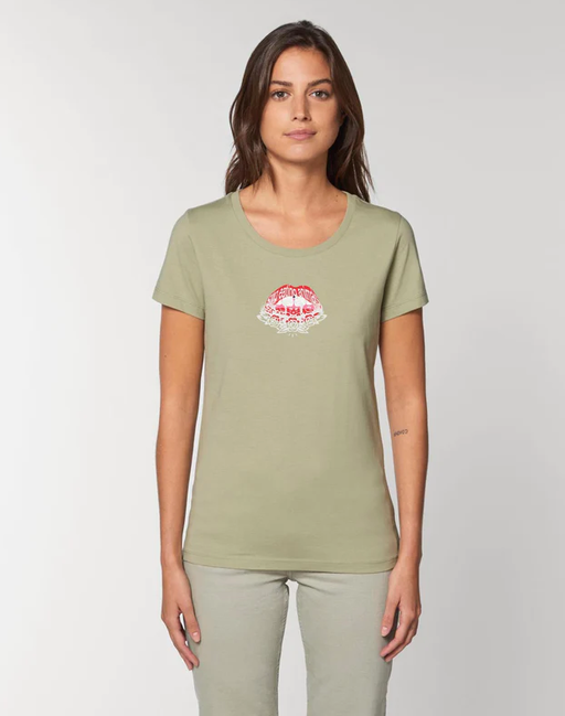 A woman wearing a Plant Faced sage color t-shirt