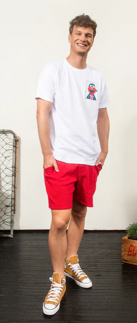 A man wearing a Retrokid sesame street elmo life  white t-shirt