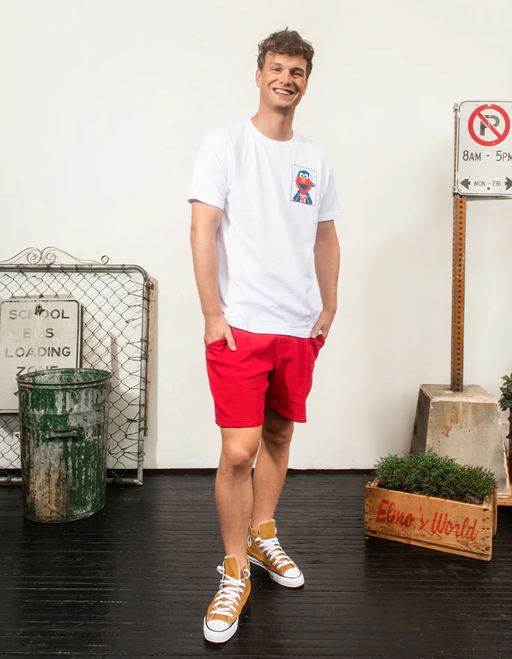 A man wearing a Retrokid sesame street elmo life  white t-shirt