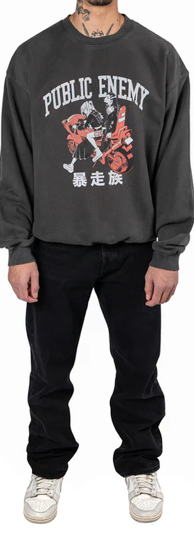 A man wearing a Animebae public enemy crewneck grey sweatshirt