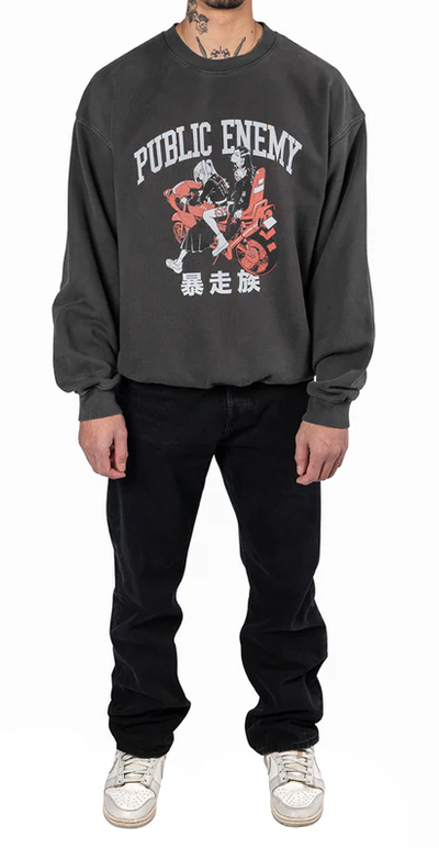 A man wearing a Animebae public enemy crewneck grey sweatshirt