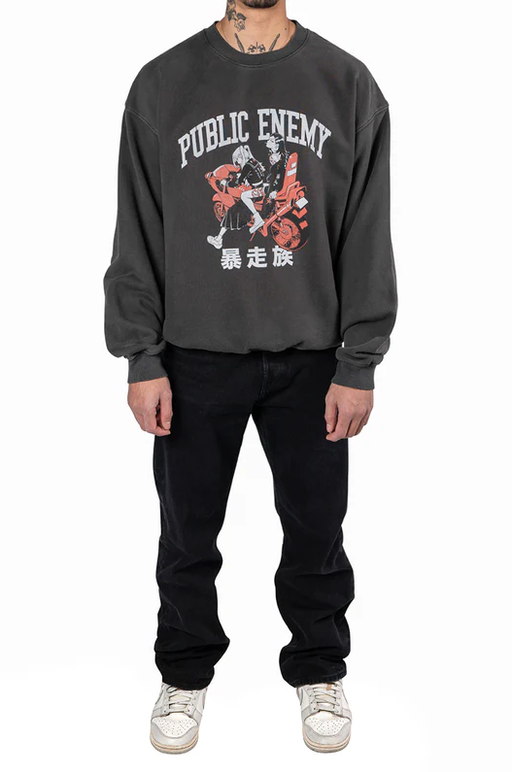 A man wearing a Animebae public enemy crewneck grey sweatshirt