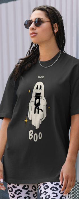 A woman wearing a Yujin Clothing boo! cat oversized faded black t-shirt