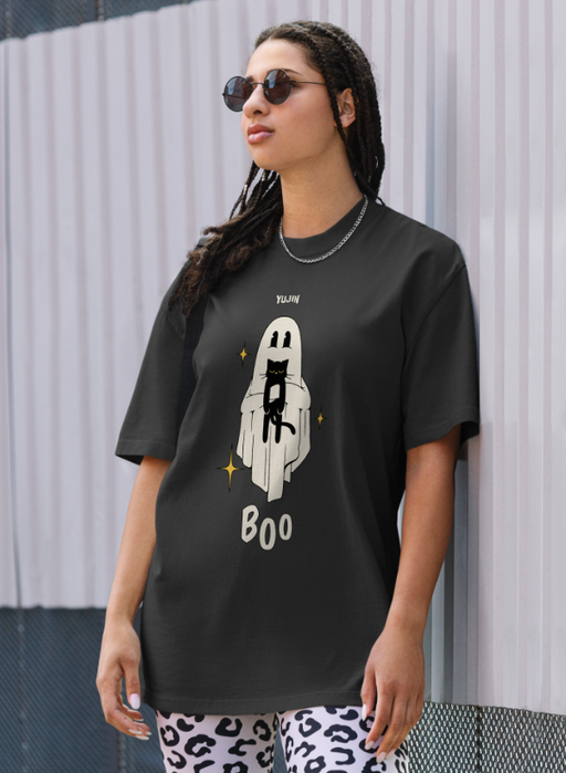 A woman wearing a Yujin Clothing boo! cat oversized faded black t-shirt