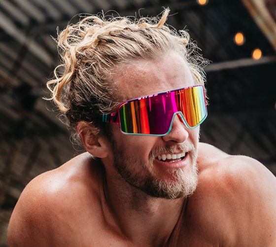 A man wearing a colorful pair of Blenders sunglasses