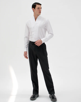 A man wearing white chimney shirt