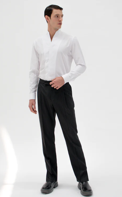 A man wearing white chimney shirt