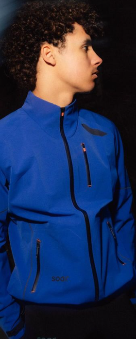 A man wearing all weather blue jacket
