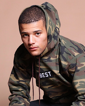 A man wearing army printed hoodie