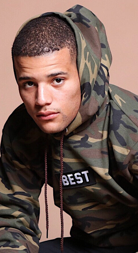 A man wearing army printed hoodie
