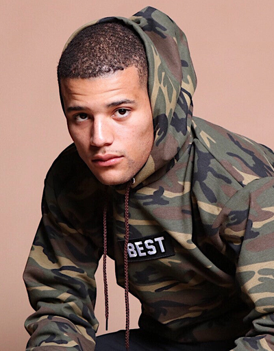 A man wearing army printed hoodie