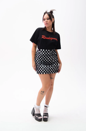 A woman wearing black rendezvous t-shirt