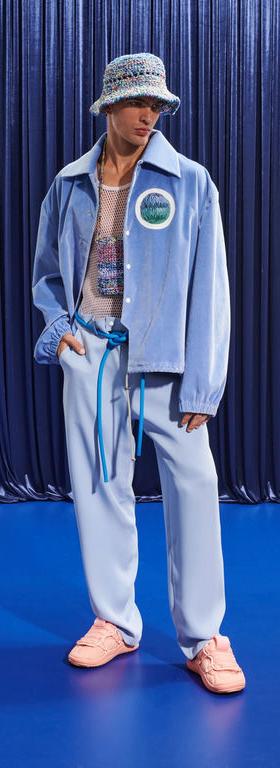 A man wearing a light blue Pigalle 2023 outfit