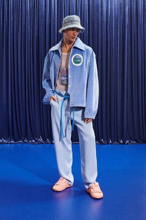 A man wearing a light blue Pigalle 2023 outfit