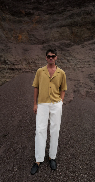 A man wearing tan merino wool s/s Charlton shirt