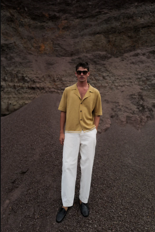 A man wearing tan merino wool s/s Charlton shirt