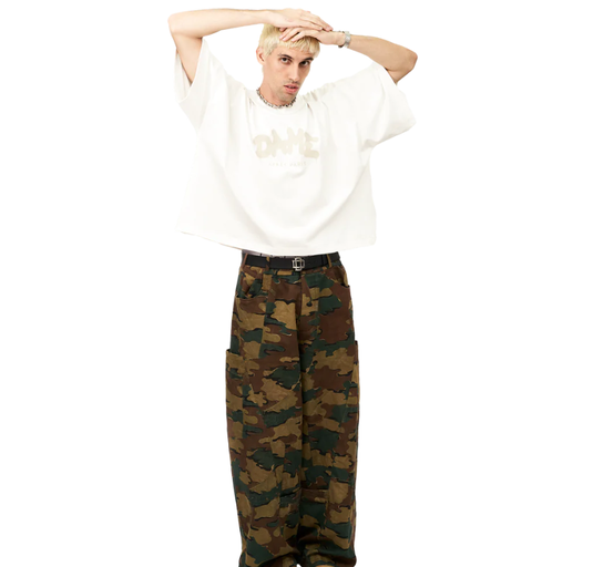 A man wearing white uniform tee