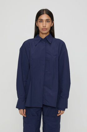 A woman wearing navy blue marie shirt